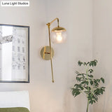 Contemporary Glass Wall Sconce With Brass Finish Arm - 1 Bulb Bedroom Light