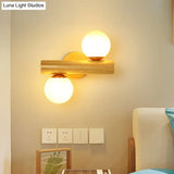 Contemporary Milk Glass Wall Lamp With Wooden Base - 2 Lights In White For Bathroom