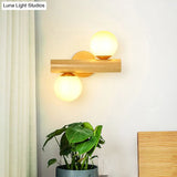 Contemporary Milk Glass Wall Lamp With Wooden Base - 2 Lights In White For Bathroom
