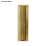 Contemporary Ribbed Wall Sconce With 2 Metallic Gold/Black Tubular Heads
