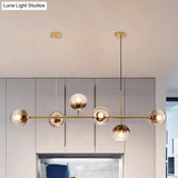 Contemporary Smoke Gray Glass Globe Hanging Light Fixture - 6 Head Gold Island