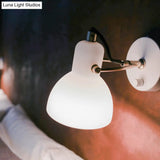 Contemporary Wall Lamp With Adjustable Arm And White Glass Dome