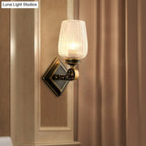 Contemporary Wall Mounted Light With Clear Textured Glass - Brass Finish