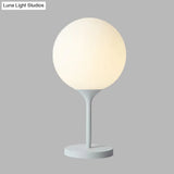 Contemporary White Bedside Table Lamp With Globe Cream Glass Shade - 1 Light