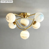 Cosmic Bedroom Glow: Gold Nordic Ombre Glass Semi-Flush Mount Chandelier With A Planet Design 6 /