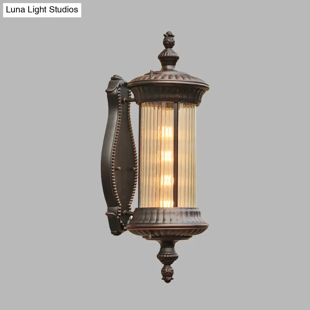 Country-Style Black Wall Sconce Lamp With Clear Ribbed Glass Cylinder Light