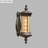 Country-Style Black Wall Sconce Lamp With Clear Ribbed Glass Cylinder Light