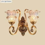Country-Style Brass Wall Sconce With Crystal Glass Flower Accent And Swooping Arm - 1/2 Bulb Light