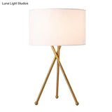 Drum Shaped Table Lamp With Metallic Tripod: Artistic Nightstand Light