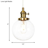 Farmhouse Orbit Pendant Light With Amber/Clear Glass And Adjustable Cord In 3 Elegant Finish Options