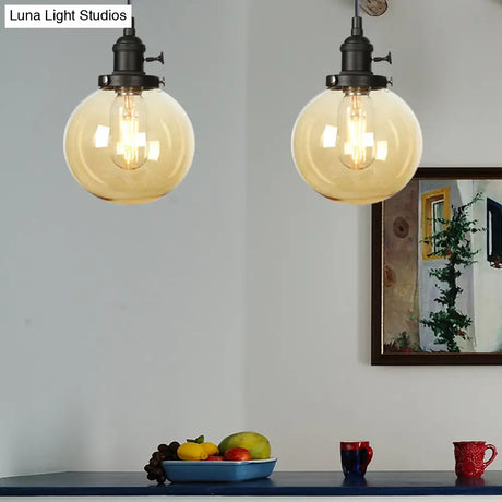 Farmhouse Orbit Pendant Light With Amber/Clear Glass And Adjustable Cord In 3 Elegant Finish Options