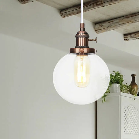 Farmhouse Orbit Pendant Light With Amber/Clear Glass And Adjustable Cord In 3 Elegant Finish