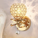 Globe Cutout Metal Shade Crystal Wall Sconce In Gold With Dropped Ball Accent