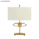 Golden Simplicity: 1-Light Table Lamp With Rectangle Fabric Shade And Crystal Prism Decor
