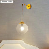 Industrial Amber Glass Wall Lamp - 1 Light Globe Sconce Fixture In Black/Brass For Living Room