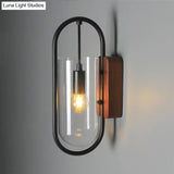 Industrial Black Cylinder Sconce Lighting - Clear/Amber Glass Wall Mount Fixture