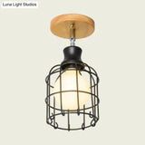 Industrial Loft Ceiling Fixture With Wire Cage And Rotatable Bulb - Black Metallic Semi-Flush Mount