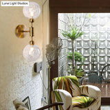 Industrial Style 1/2-Light Bedroom Sconce Wall Lamp - Black/Brass Finish With Clear Glass Shade
