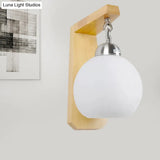 Industrial Wall Sconce With Opal Glass Globe Shade And Wood Backplate - Bedroom Lighting Fixture