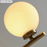 Ivory Glass Single Wall Sconce With Gold Finish For Bedroom - Simple And Elegant