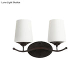 Ivory Glass Vanity Lighting With Iron Wavy Arm - Traditional Black Tapered Wall Light For Bedroom