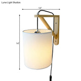 Japanese Style Cylindrical Fabric Wall Sconce With 1-Bulb And Wood Mount
