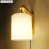 Japanese Style Cylindrical Fabric Wall Sconce With 1-Bulb And Wood Mount
