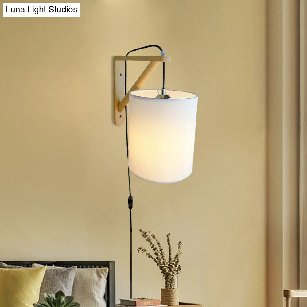 Japanese Style Cylindrical Fabric Wall Sconce With 1-Bulb And Wood Mount