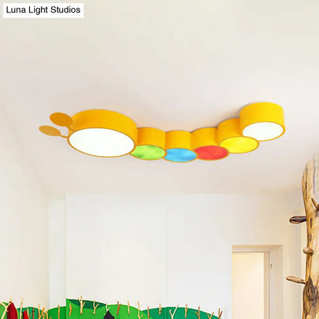 Lighting Up Learning: Yellow Metal LED Flush Mount Fixture with Adorable Cartoon Caterpillar Design for Kindergarten
