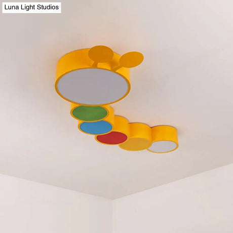Lighting Up Learning: Yellow Metal LED Flush Mount Fixture with Adorable Cartoon Caterpillar Design for Kindergarten