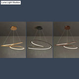 Metal Led Chandelier: Sleek Seamless Curves For Minimalistic Dining Room Lighting