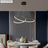 Metal Led Chandelier: Sleek Seamless Curves For Minimalistic Dining Room Lighting