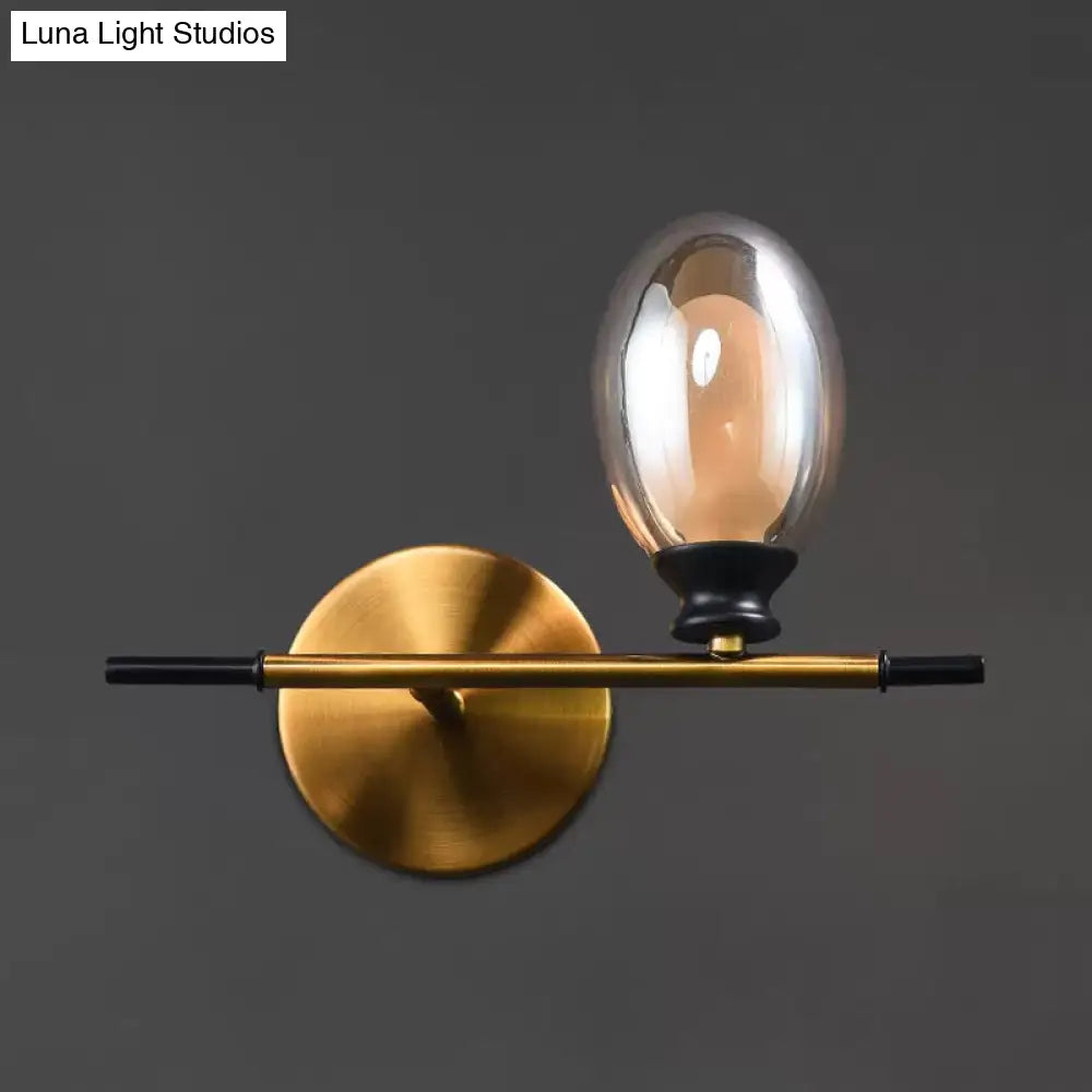 Mid Century Brass Wall Lamp With Dual Oval Clear/Amber Glass Shade