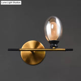 Mid Century Brass Wall Lamp With Dual Oval Clear/Amber Glass Shade