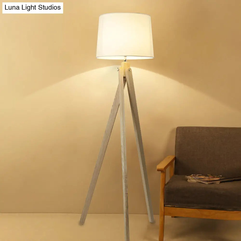Minimalist Beige Tri-Leg Floor Lamp With Tapered Drum Shade - 1-Light Standing Light Fixture