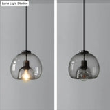 Minimalist Black Glass Pendant Light For Modern Dining Rooms