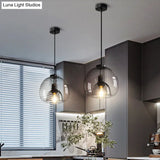 Minimalist Black Glass Pendant Light For Modern Dining Rooms