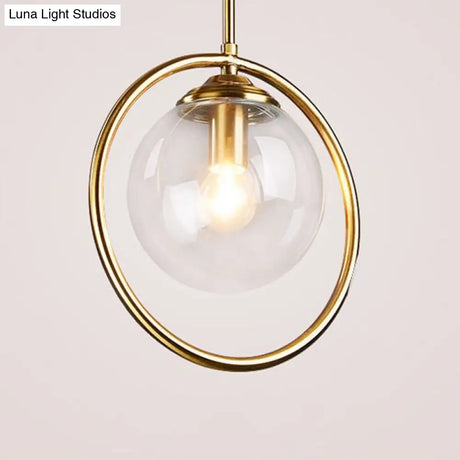 Minimalist Brass Plated Ball Drop Pendant Light With Clear Glass And Ring Decoration