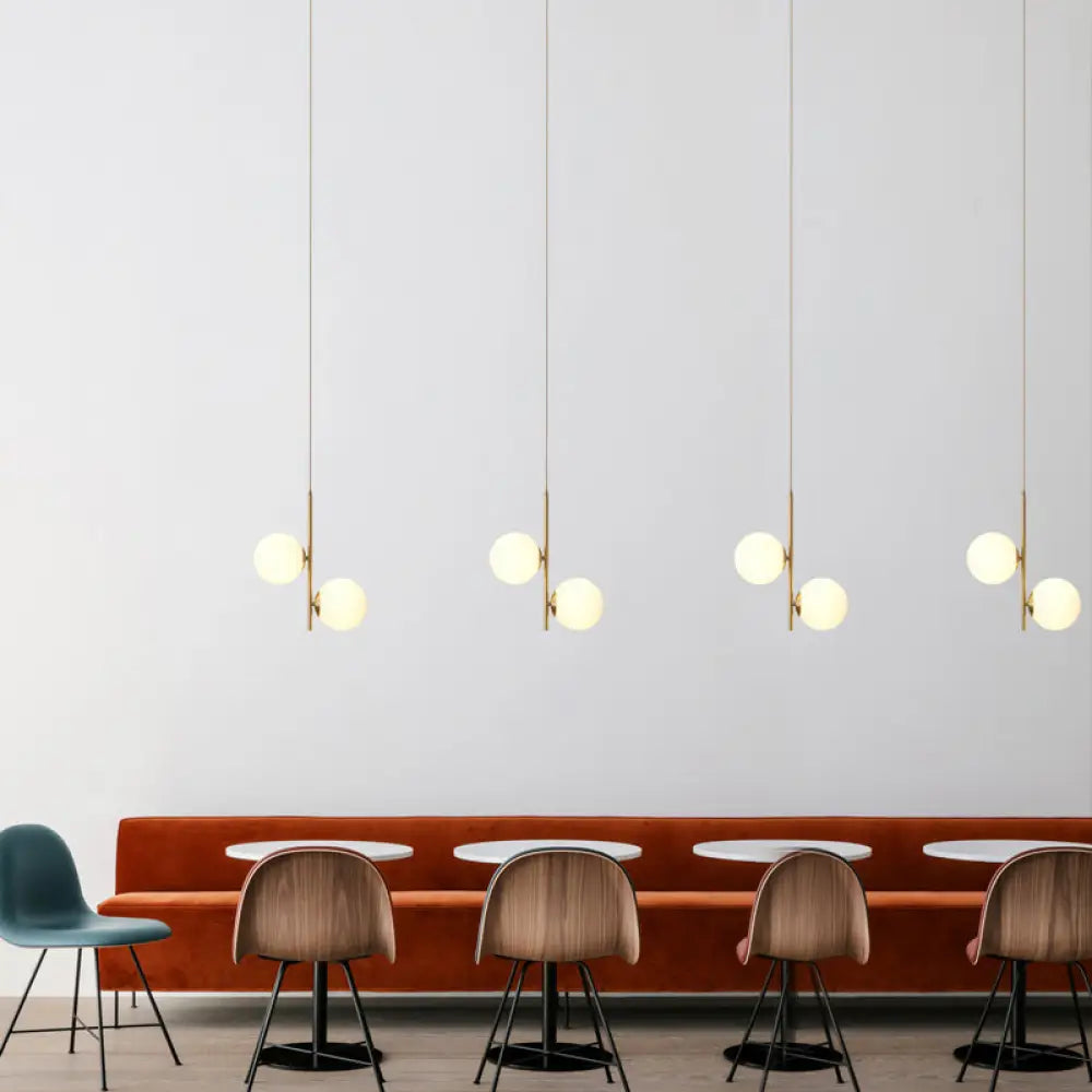 Modern Gold Suspended Light Fixture With Opaque Glass Spheres - Ideal For Dining Room Décor