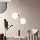 Minimalist Gold Suspension Chandelier: Opaque Glass Spherical 2-Head Light For Dining Room