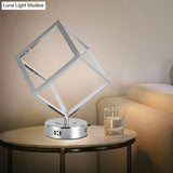 Minimalist Metal Led Bedside Lamp With Chrome Finish - Cubic Frame Round Base