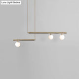 Minimalist Metal Pendant Lighting With Gold Accents - Modern Globe Glass Island Ceiling Light For
