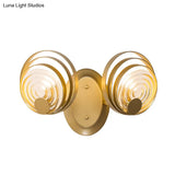 Minimalist Metallic Gold Swirling Wall Sconce - Elegant 1/2-Light Round Lighting Idea