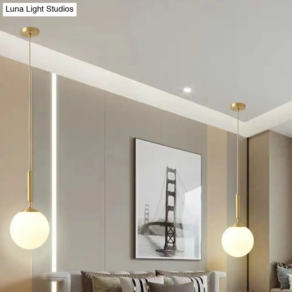 Minimalist Milk Glass Ball Pendant Light In Brass - 1-Light Hanging Lamp For Dining Room