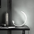 Minimalist Moon Shape Led Metallic Table Lamp With White Finish For Bedside Lighting