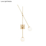 Minimalist Opal Glass Bubble Wall Sconce With Metal Arm - 2 Bulb Light Fixture In Black/Gold