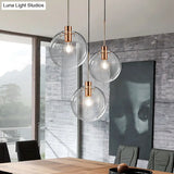 Minimalist Rose Gold Cluster Pendant With Clear Glass For Ceiling - 3-Bulb Fixture