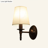 Minimalist Single Wall Mount Light With Tapered Drum Fabric Shade - Ideal For Corridors