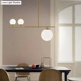 Minimalistic Brass Ball Pendant Light: Opal Glass Island Lighting For Dining Room (3-Light)
