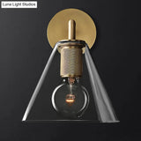 Minimalistic Brass Wall Sconce With Clear Glass For Bedside Lighting